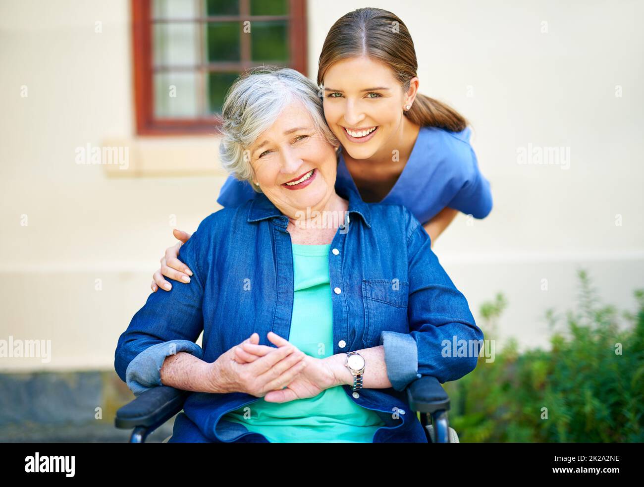 Giving care to the best of her abilities. Shot of a resident and a nurse outside in the retirement home garden. Stock Photo