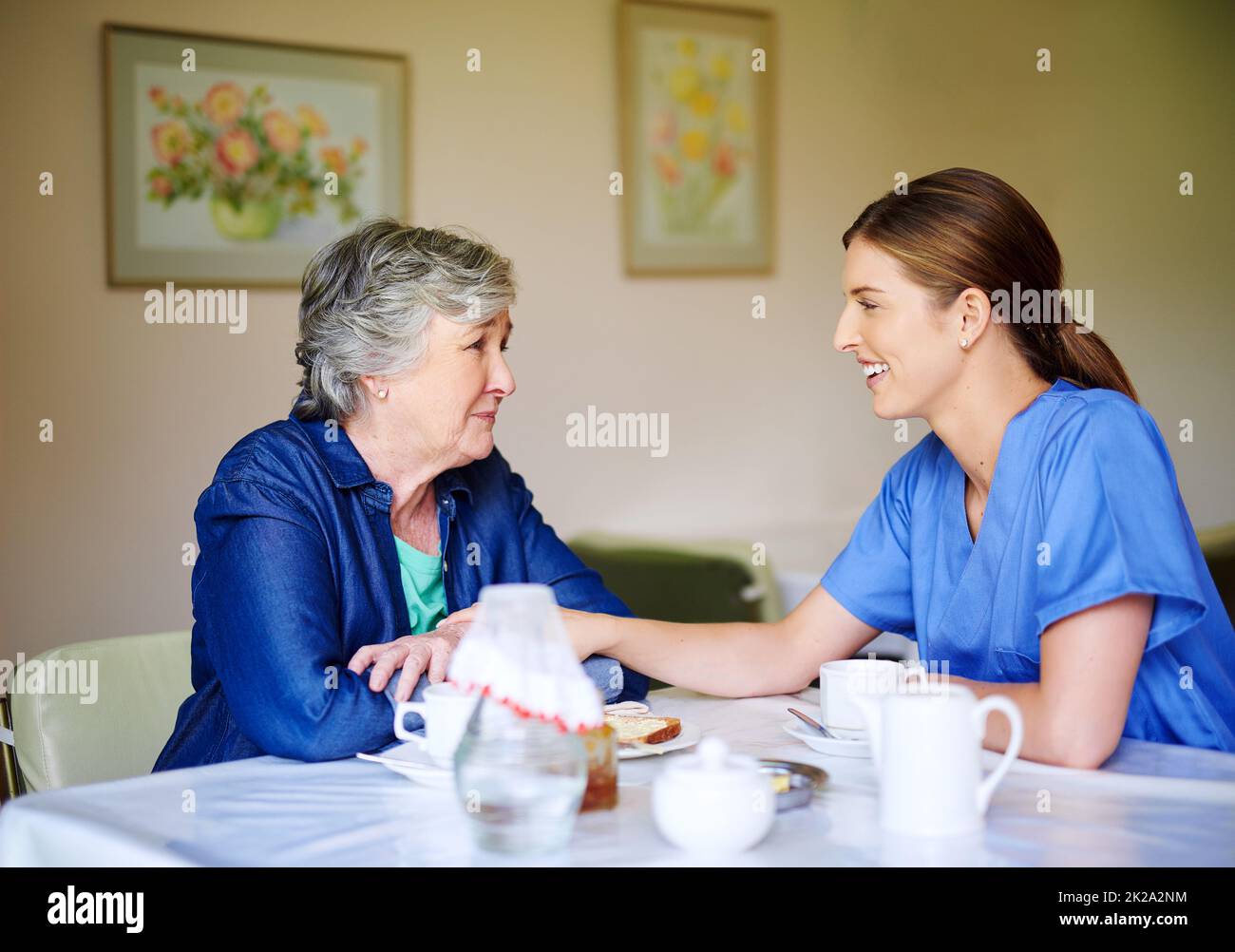 Tell me all about it. Shot of a resident and a nurse at a retirement