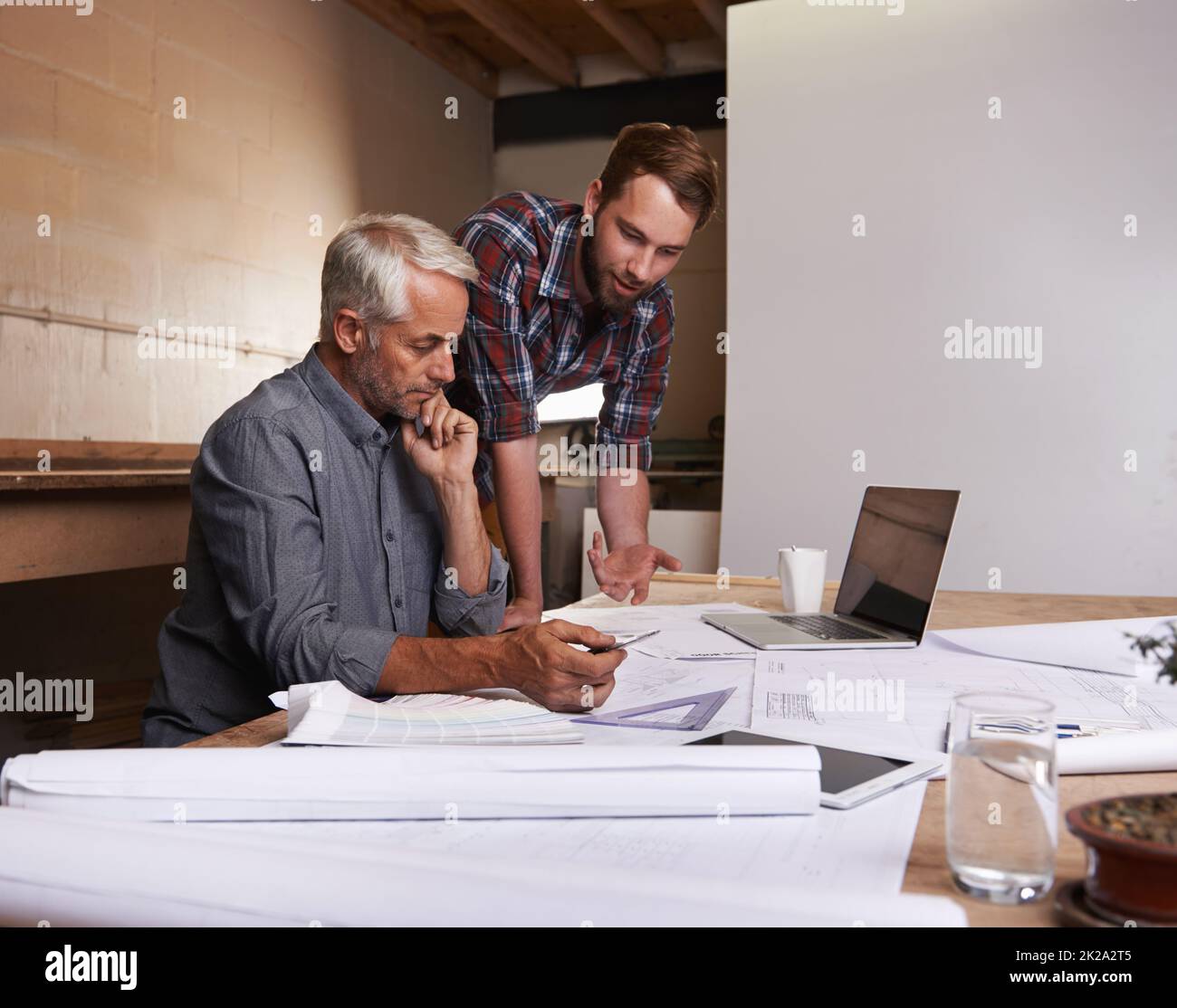 Turning his vision into reality. An architect drawing up plans Stock