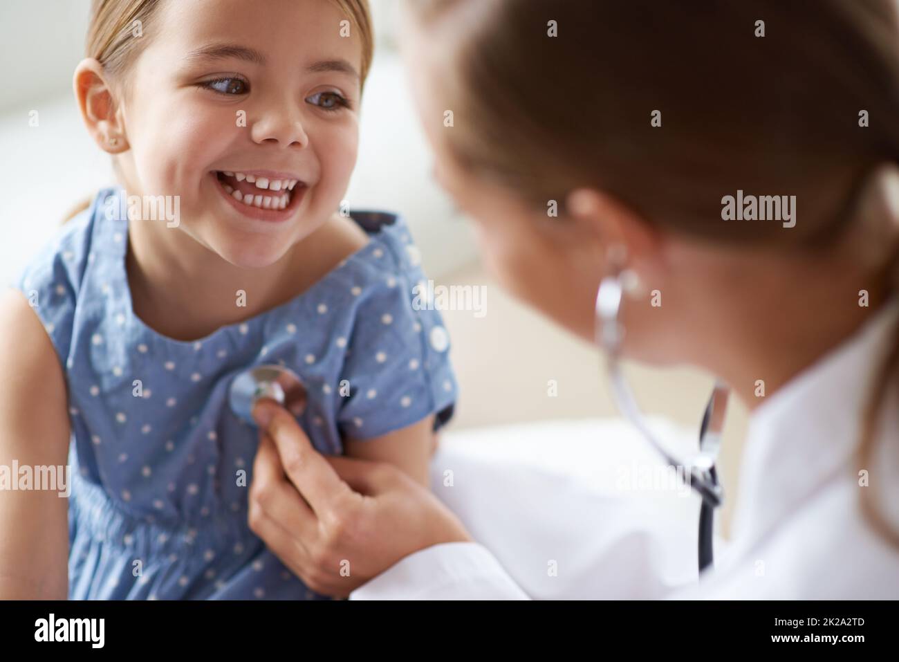 That tickles. Cropped shot of an adorable young girl with her ...