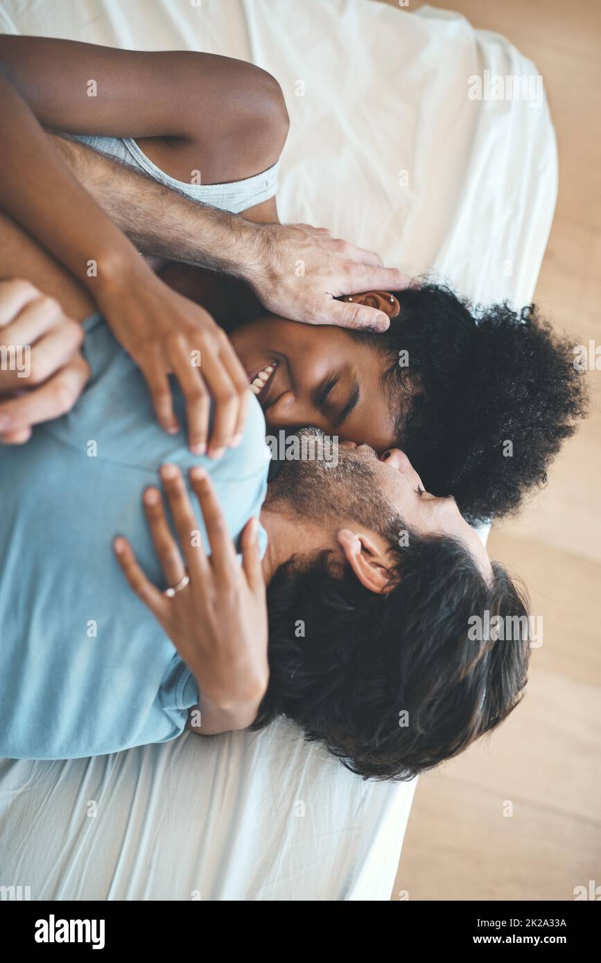 Couple bed bedroom kiss love romance hugging hi-res stock photography and  images - Alamy