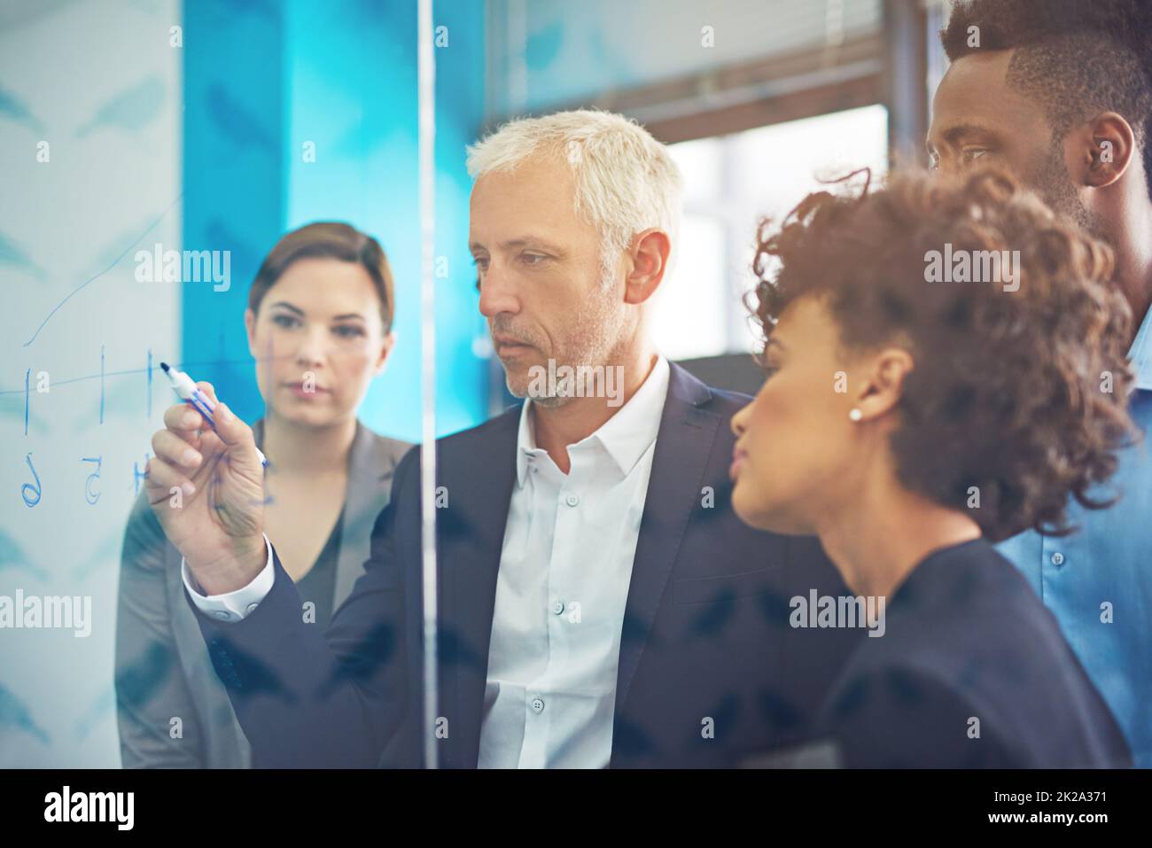 Problem solving through teamwork and professionalism. Shot of a group of colleagues having a brainstorming session at work. Stock Photo