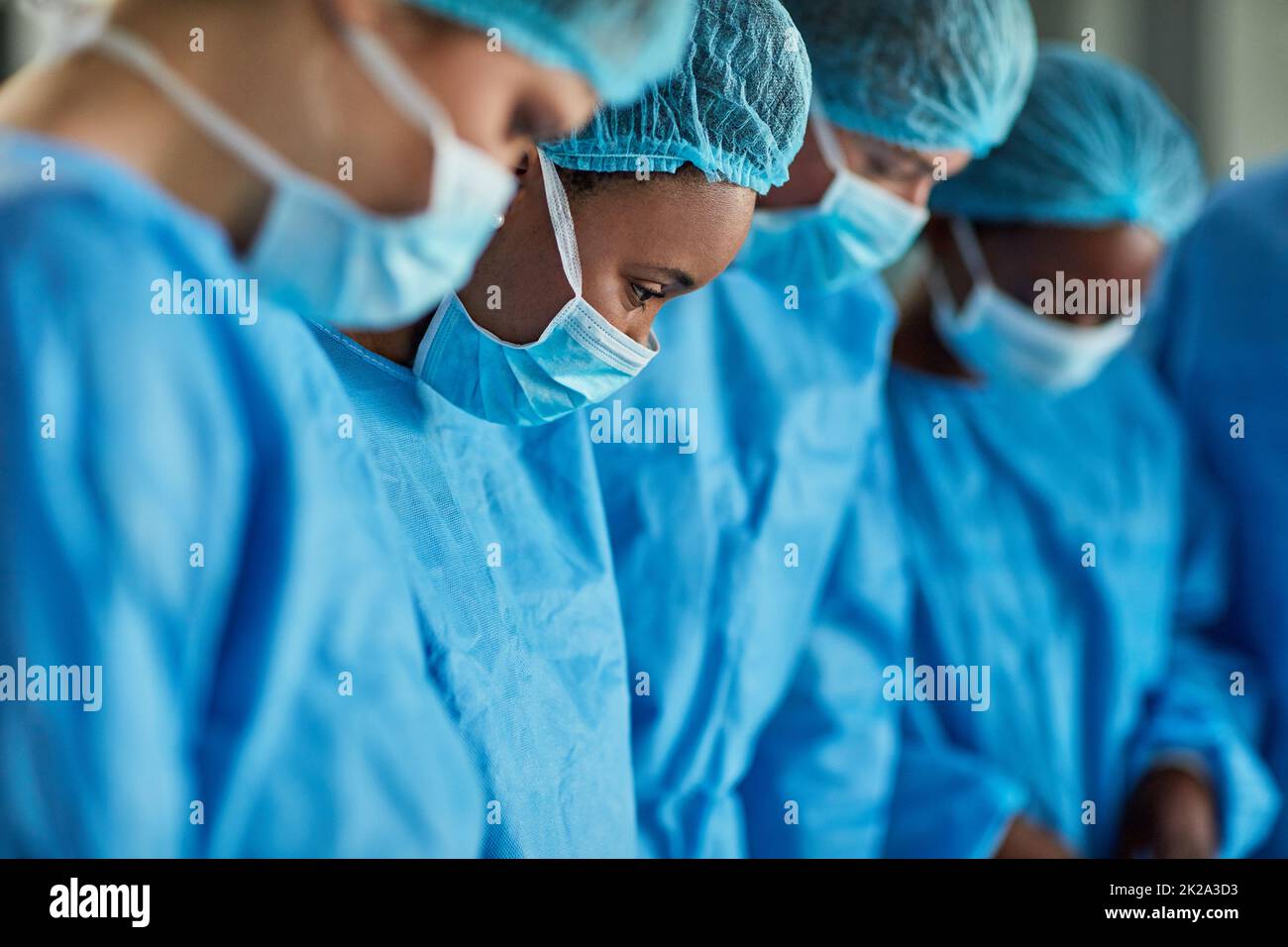 Focused in the operating theatre. Cropped shot of a group of surgeons