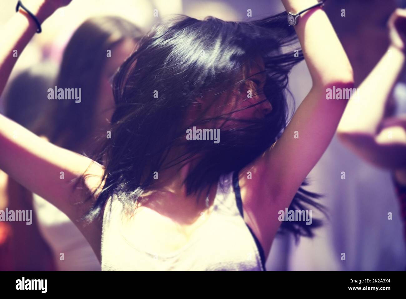 Dancing the night away. A young woman dancing. Stock Photo