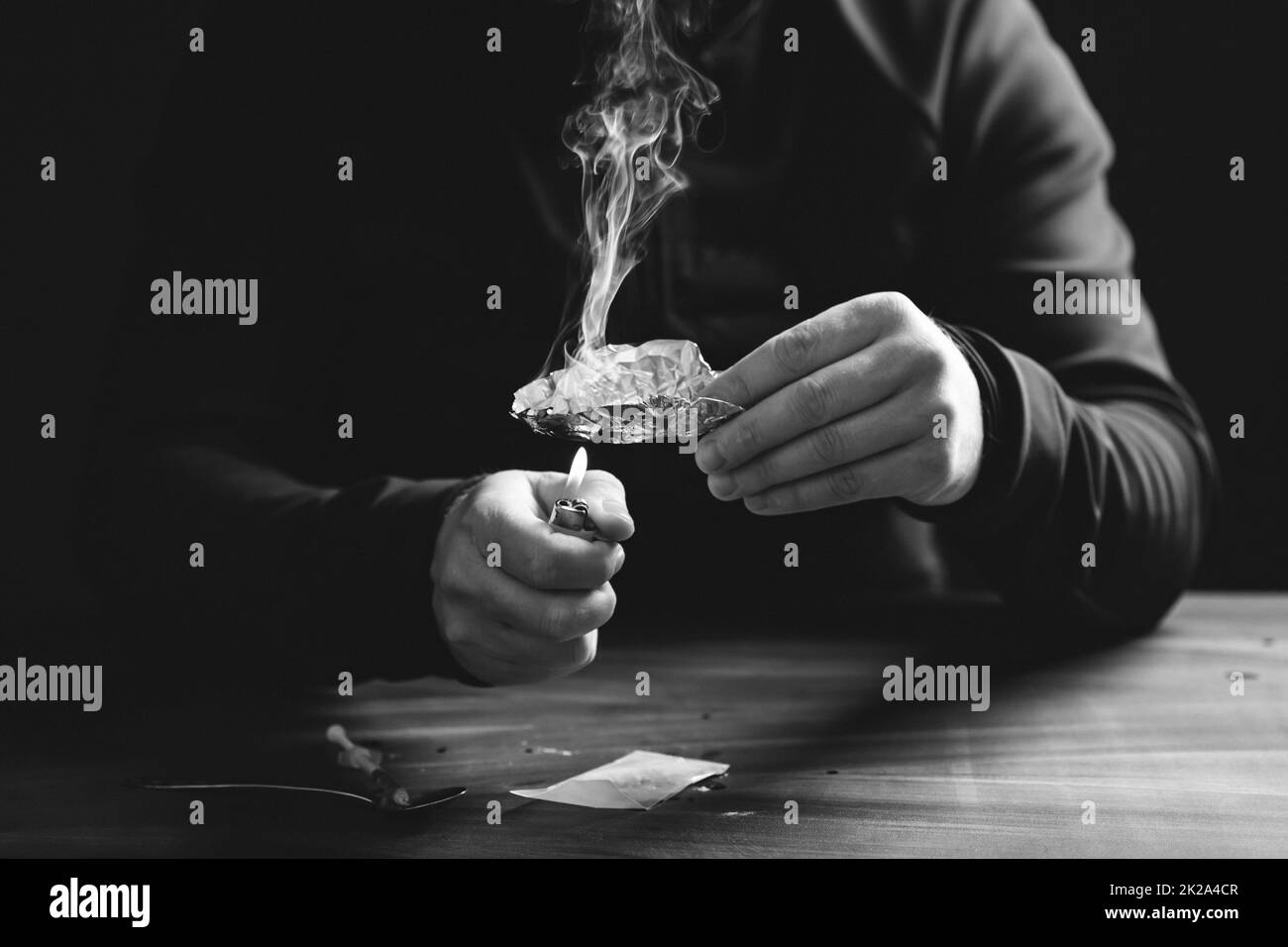 Drug addict man or drug dealer prepares heroin Stock Photo Alamy