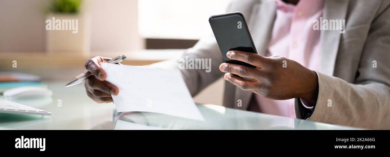 Remote Check Deposit Using Mobile Remote Stock Photo