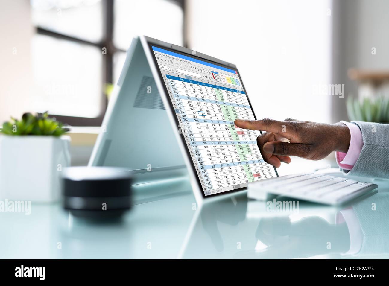 African American Analyst Using Spreadsheet Stock Photo