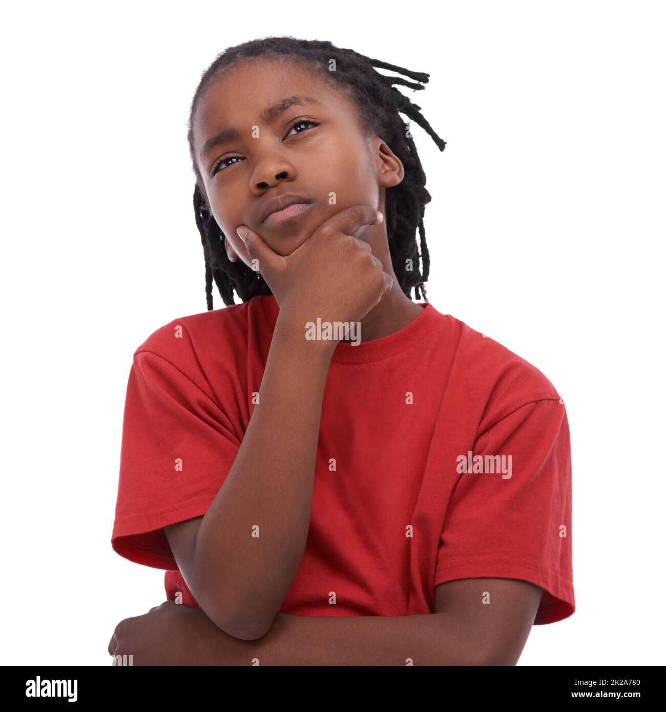 Hes got some things on his young mind. An African boy looking thoughtful. Stock Photo