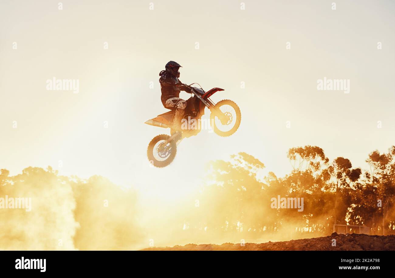 Hes way out in front. A shot of a motocross rider in midair during a race. Stock Photo