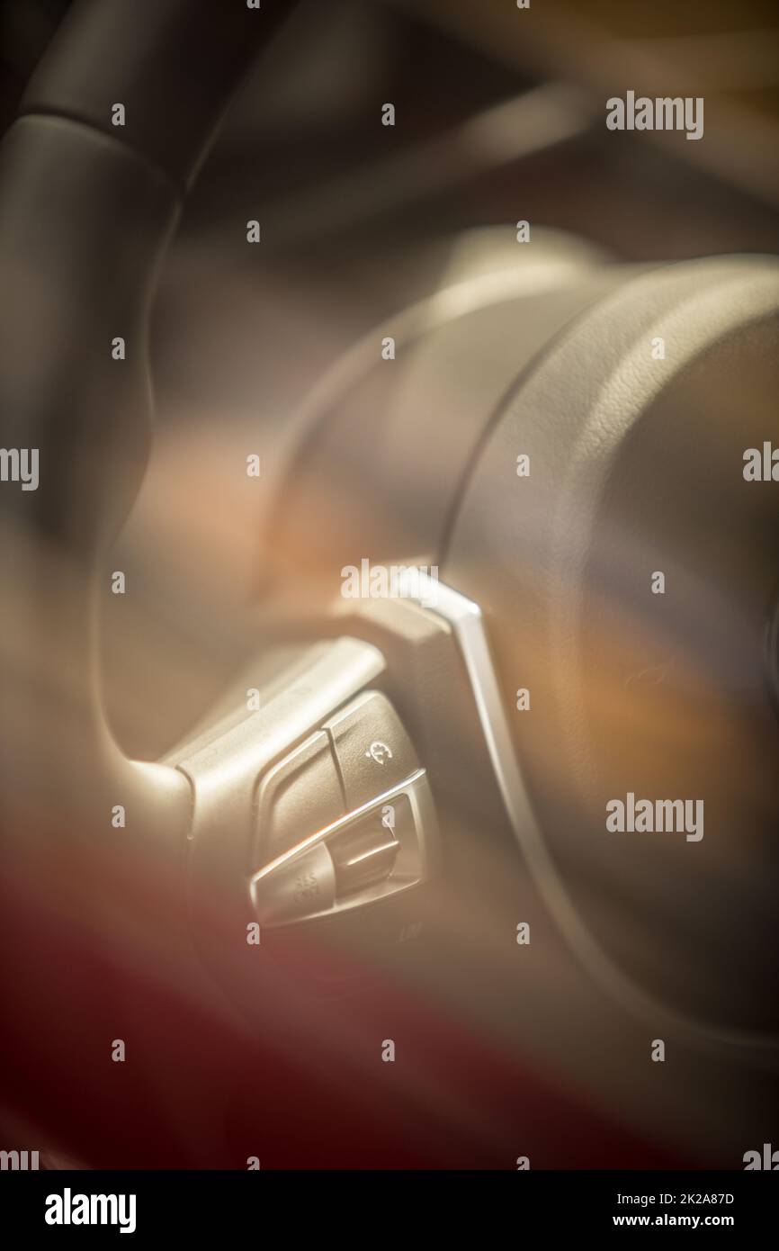 Cruise control buttons on modern car steering wheel Stock Photo Alamy