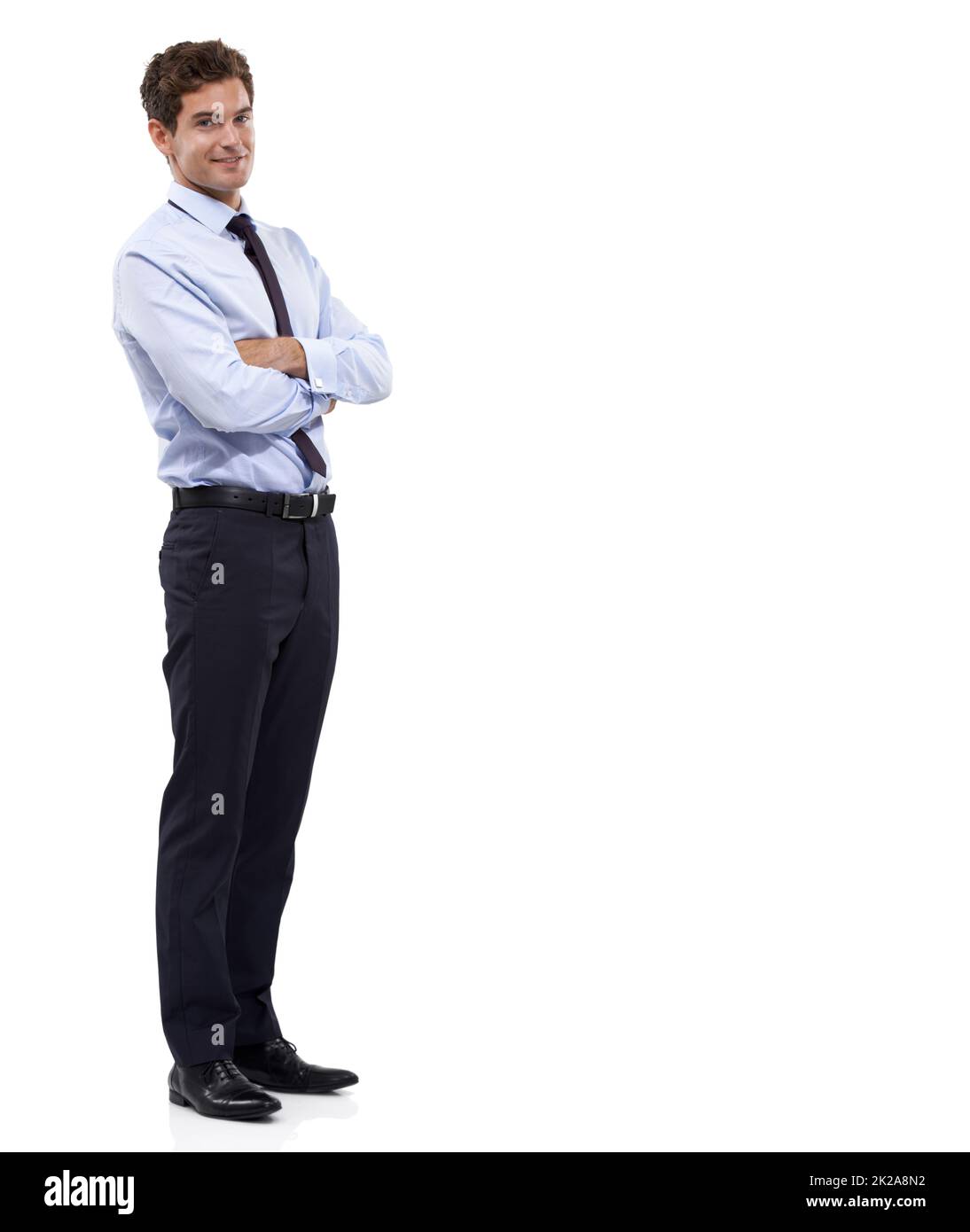 Confidently endorsing your copyspace. A handsome young businessman standing against a white background. Stock Photo
