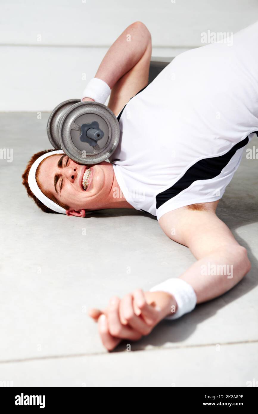 The weight of expectation is too great. A young man trying to lift some