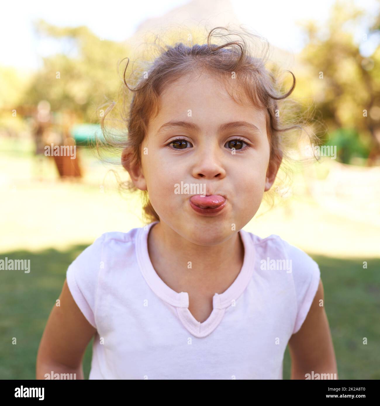 Cant make me. Portrait of a cheeky little girl sticking out her tongue