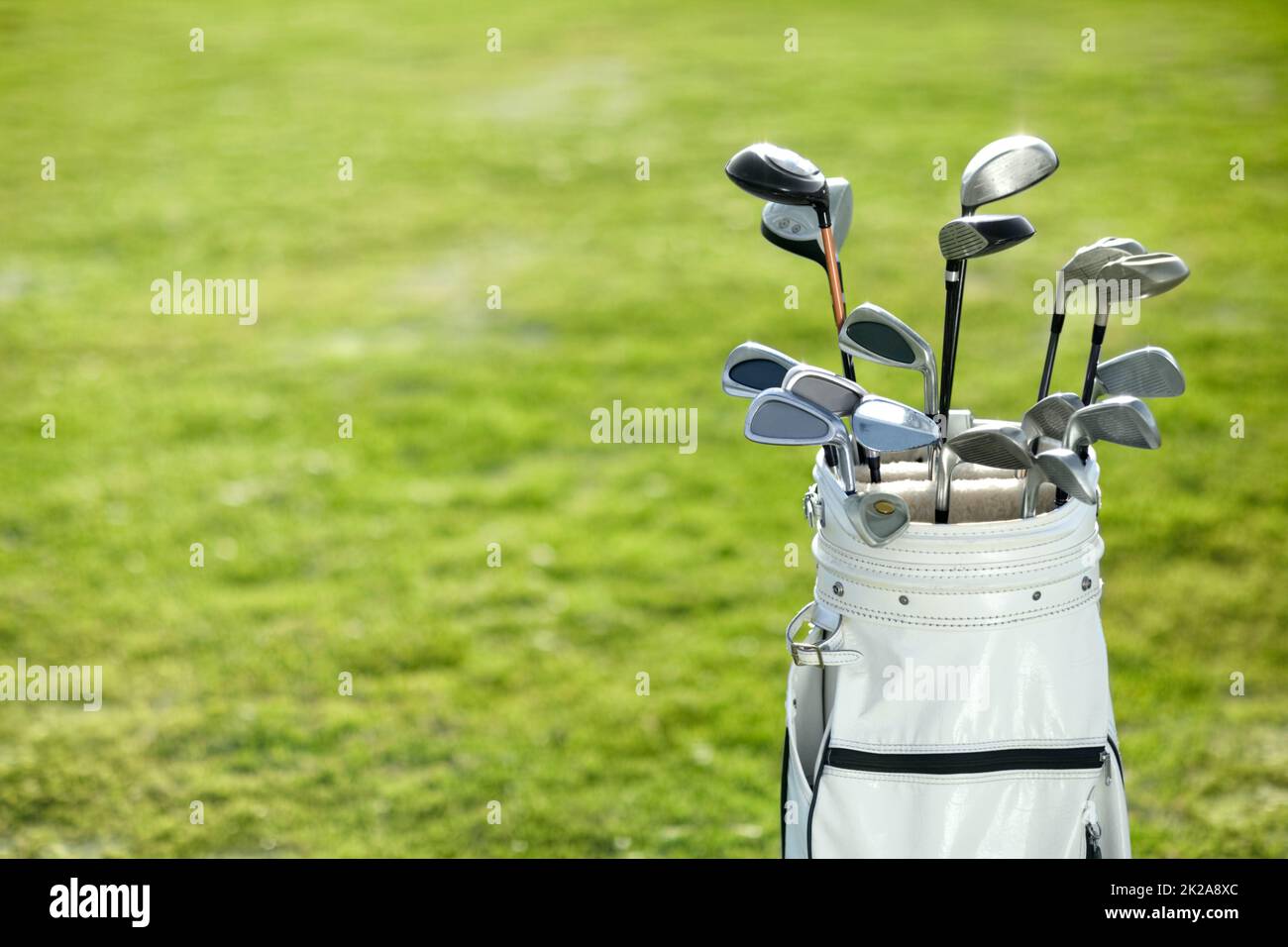You cant play without these. A golf bag on the golf course. Stock Photo