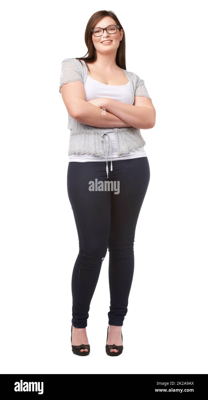 Young beautiful plus size model wearing in black leggings and white shirt,  xl woman on gray studio background Stock Photo