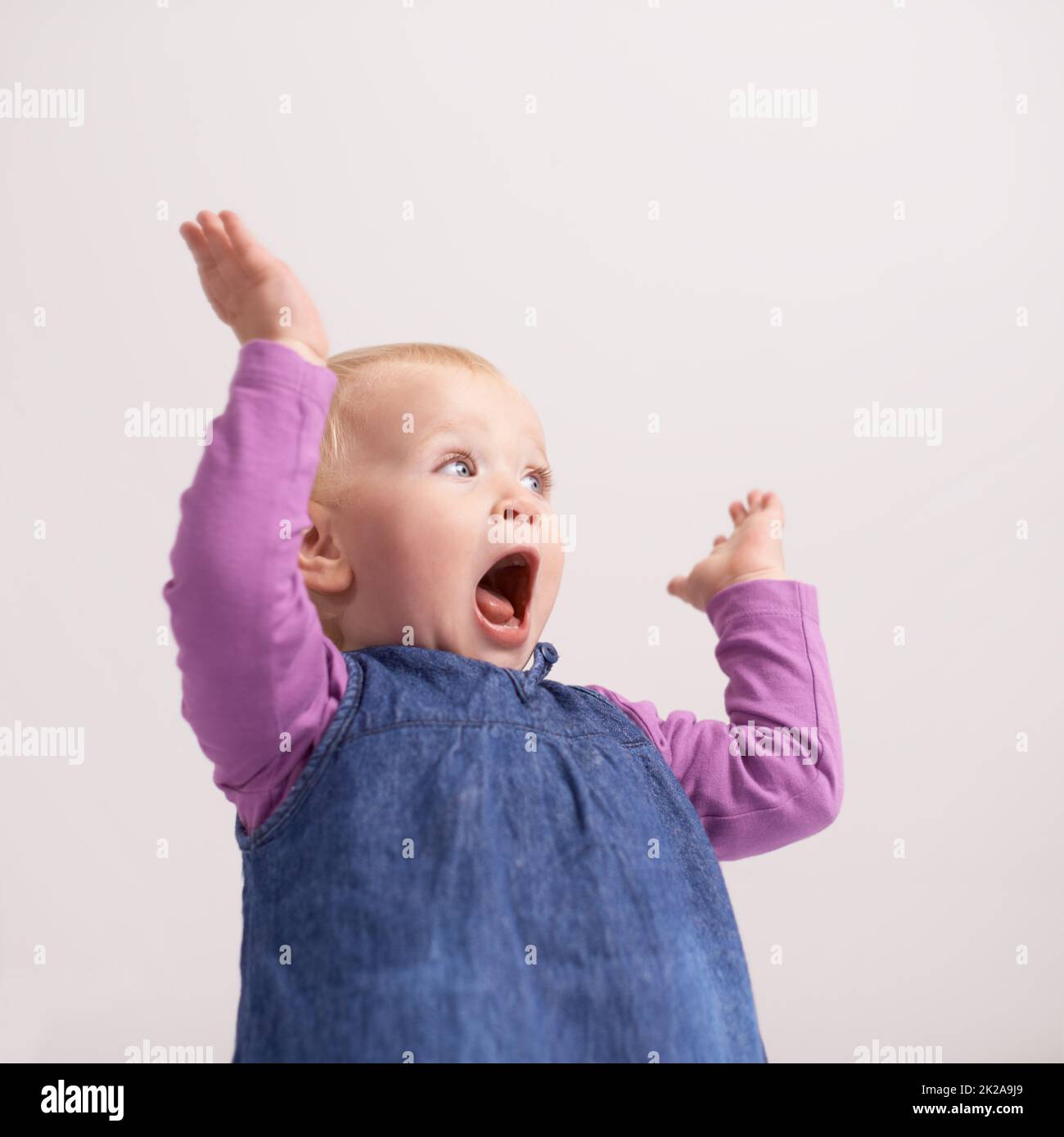 Hes the cutest little boy. A shot of a baby girl with a startled expression. Stock Photo