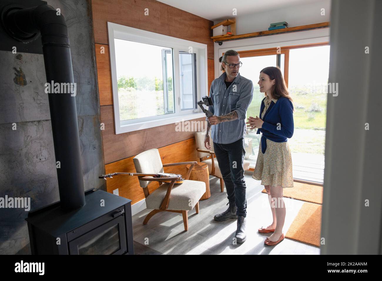 Couple filming vlog in small home Stock Photo