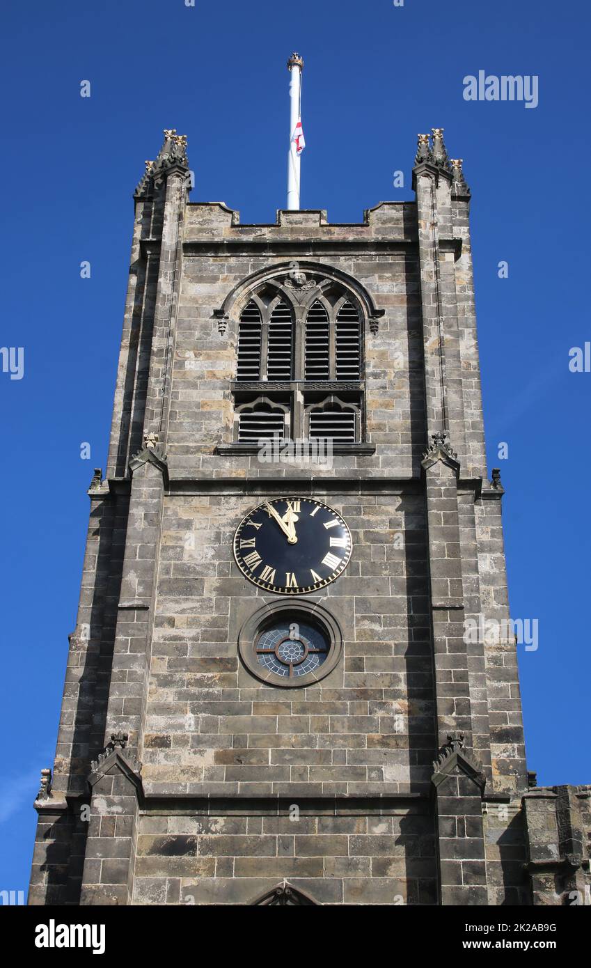 View of the square bell tower with clock and flagpole on Lancaster Priory Church of St Mary, Lancaster, Lancashire, England , September 2022. Stock Photo