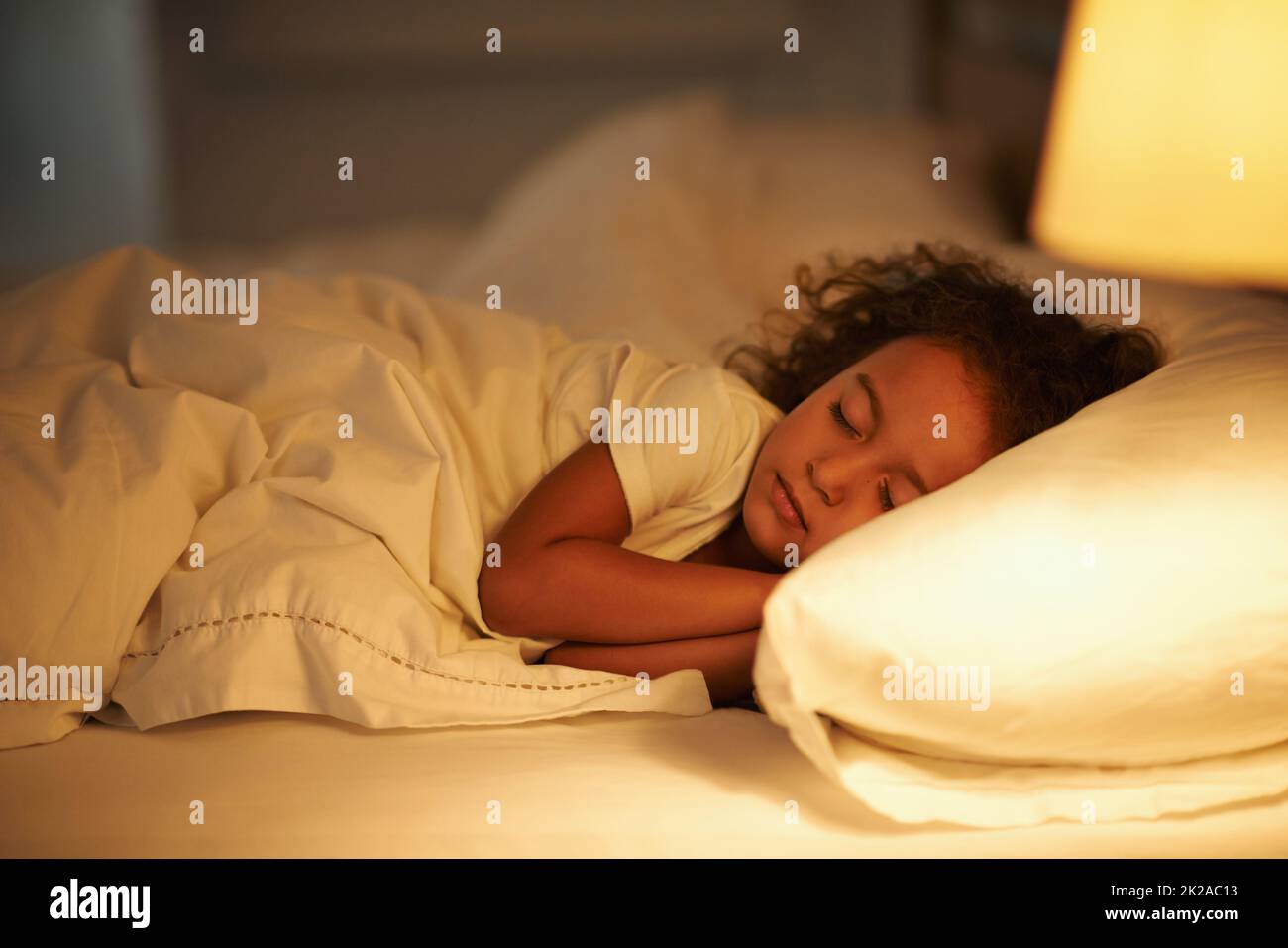 I like moms bed the best. A cute little girl fast asleep in a double