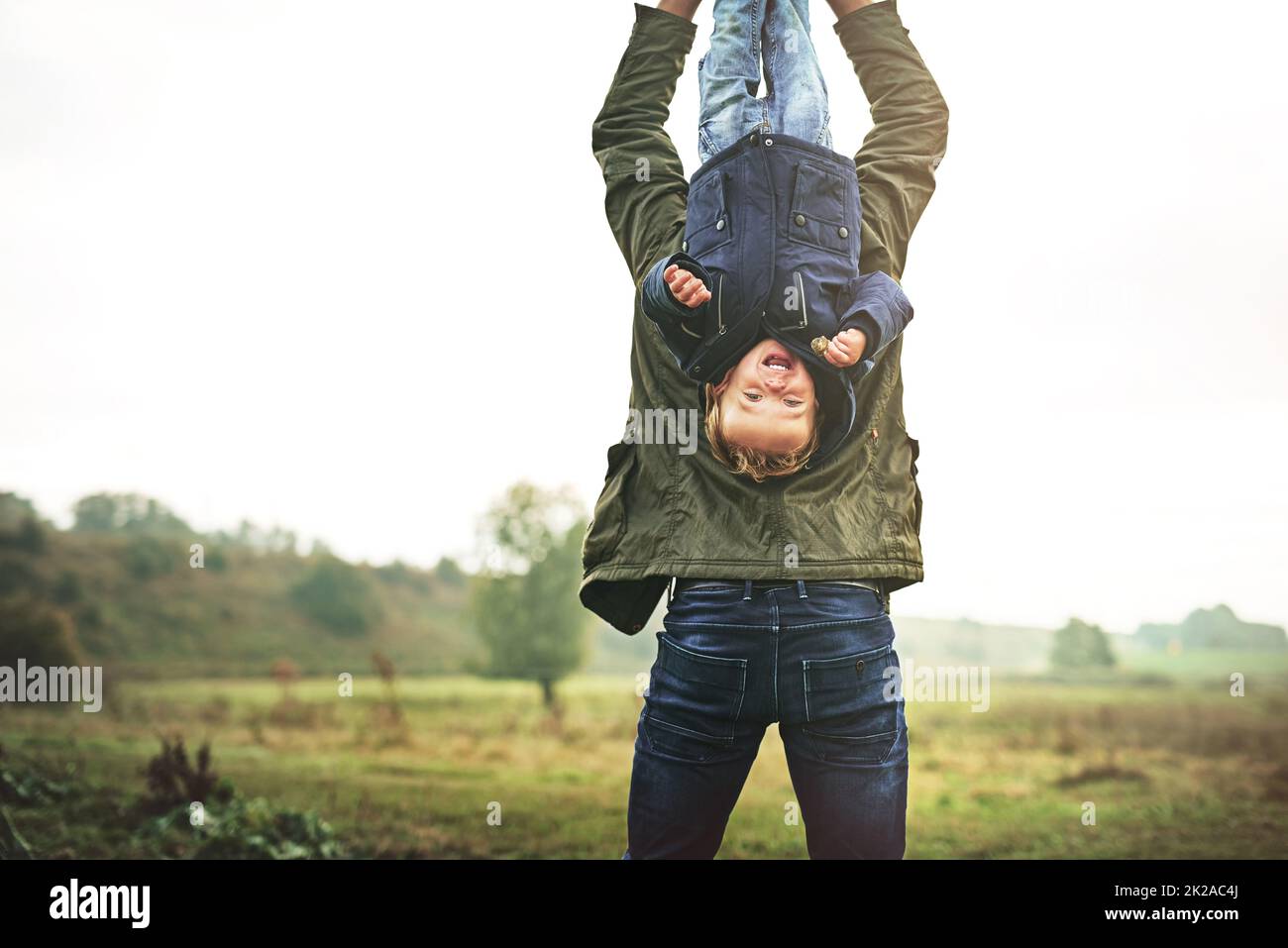 Childhood is fun from every angle. Cropped shot of a father bonding with his son outside. Stock Photo