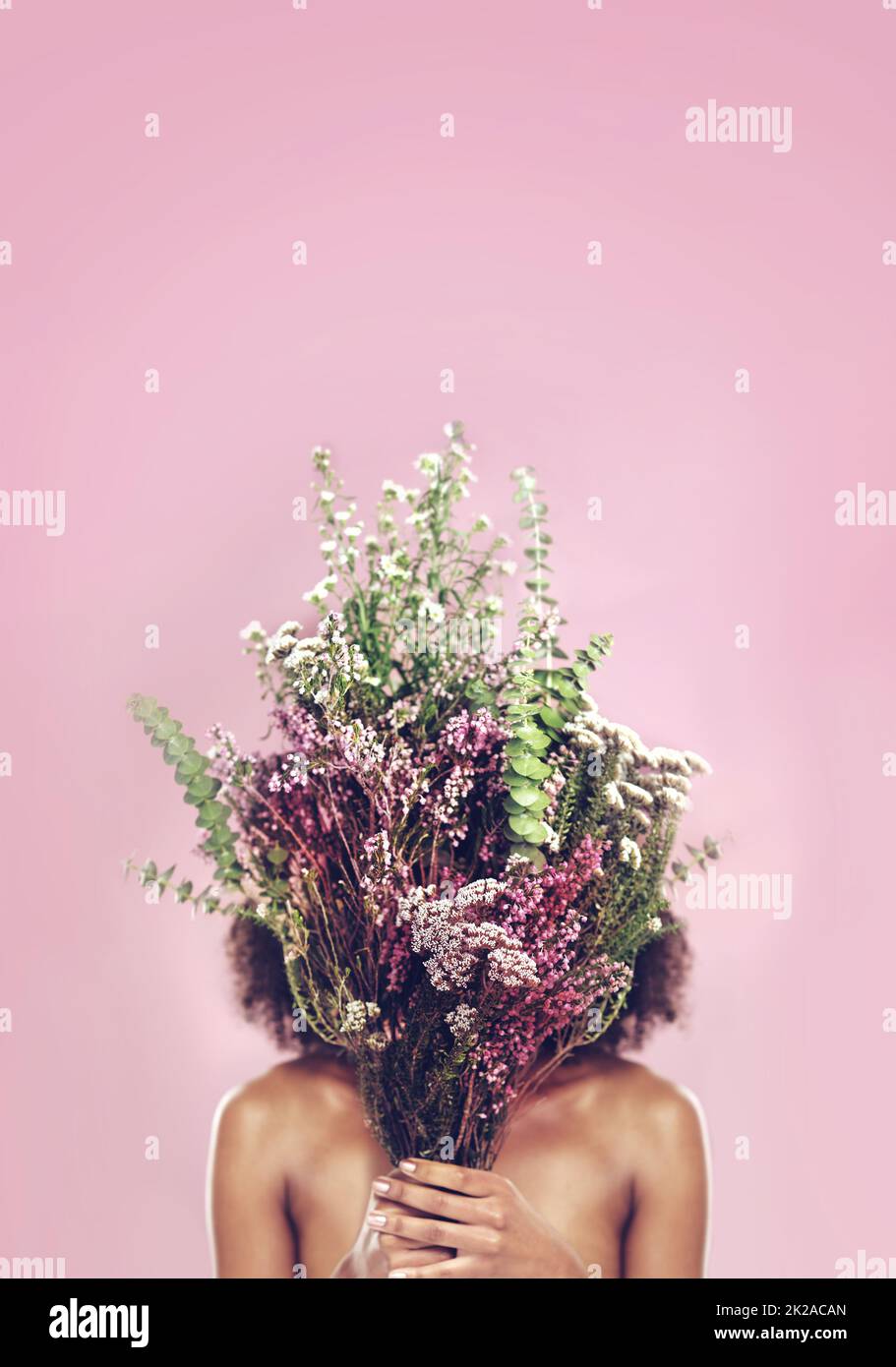 Graceful Woman Holding Flowers And Striking A Pose Against A Light  Background Photo And Picture For Free Download - Pngtree