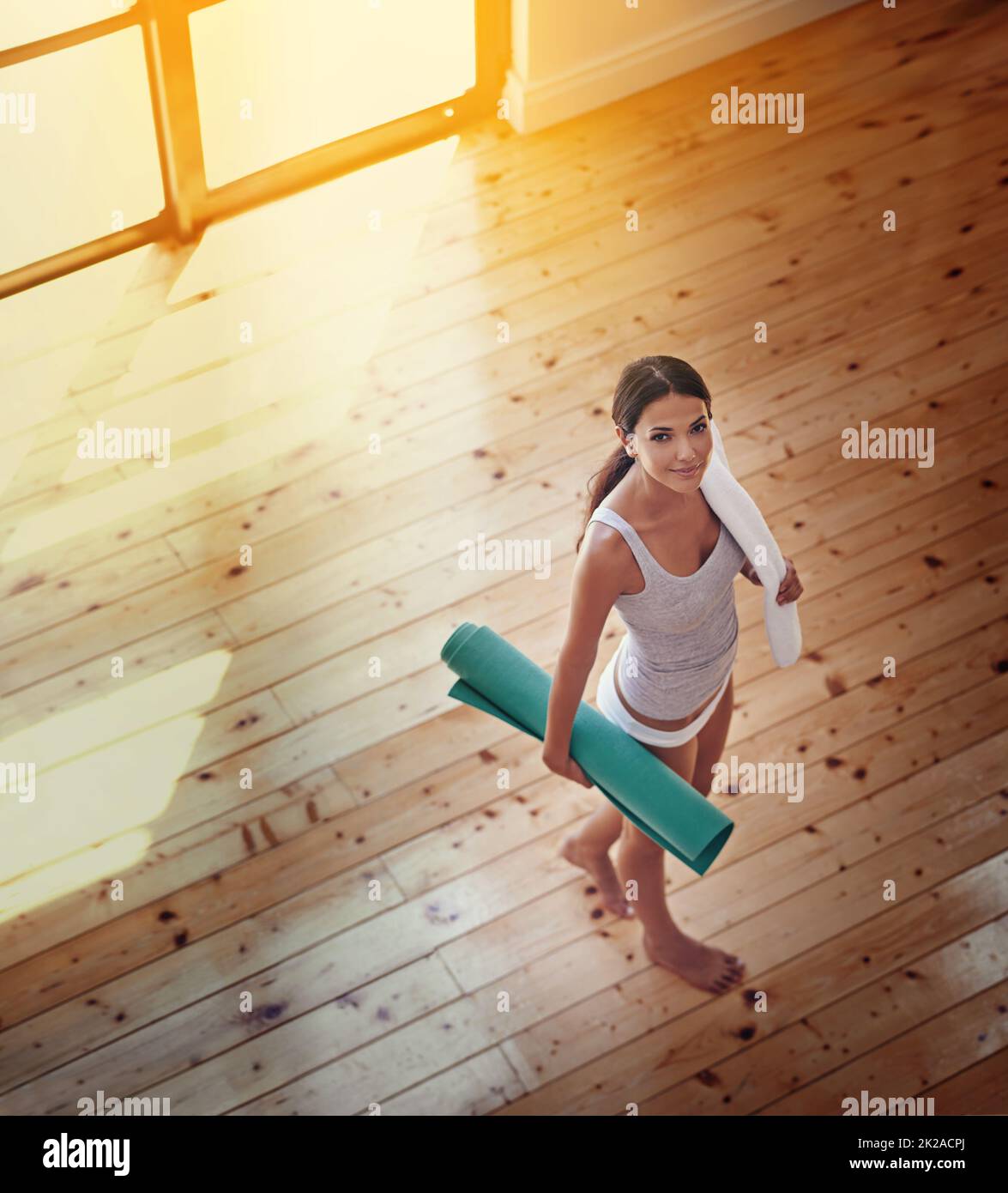 Ready for a session of yoga. High angle portrait of a young woman ready to do yoga at home. Stock Photo