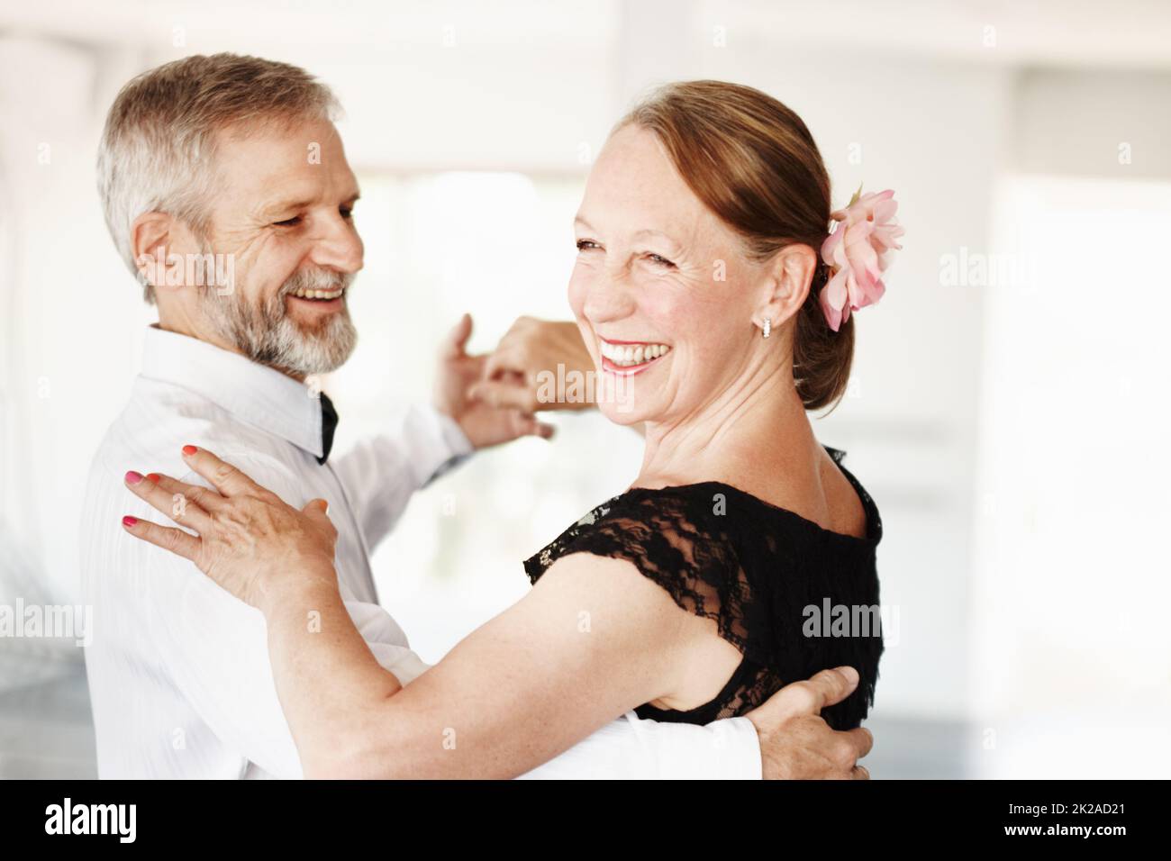 Keeping the romance alive. Shot of a mature couple dancing together in formal attire. Stock Photo