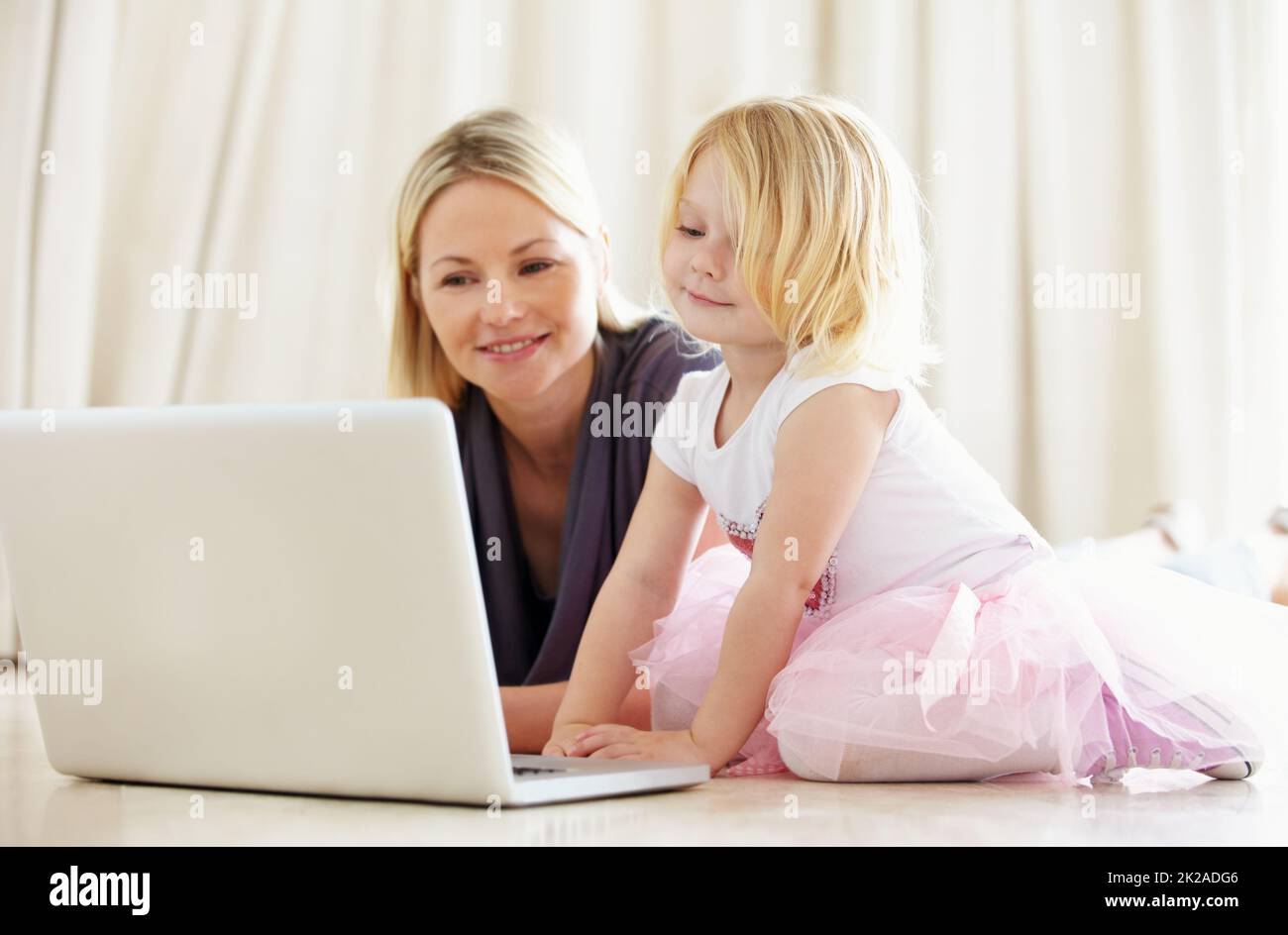 Shes pretty techno-savvy for such a young kid. Shot of a mother and daughter bonding while surfing the internet together. Stock Photo