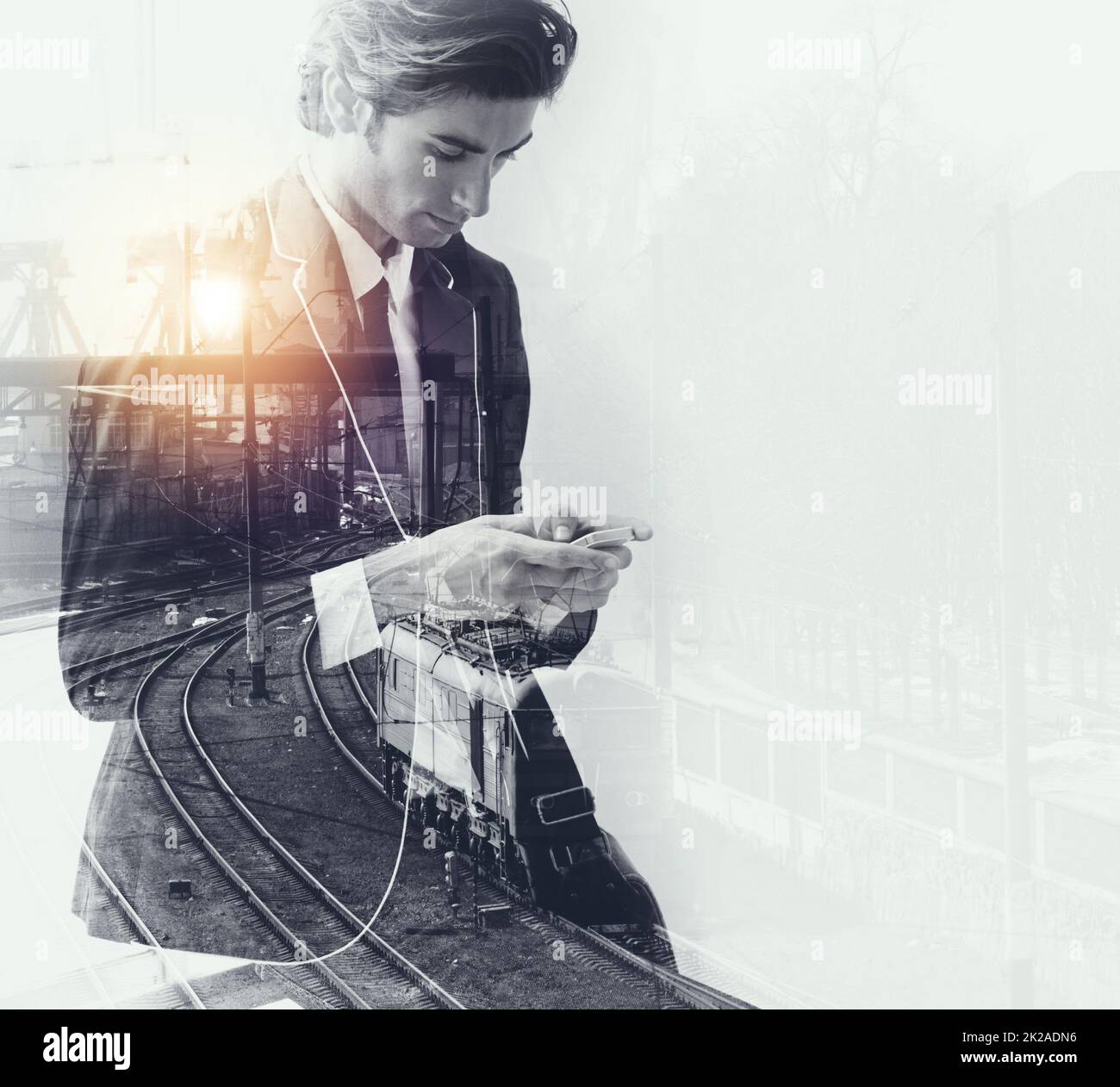 He has all the right connections. Multiple exposure shot of a business man superimposed over a traintrack. Stock Photo