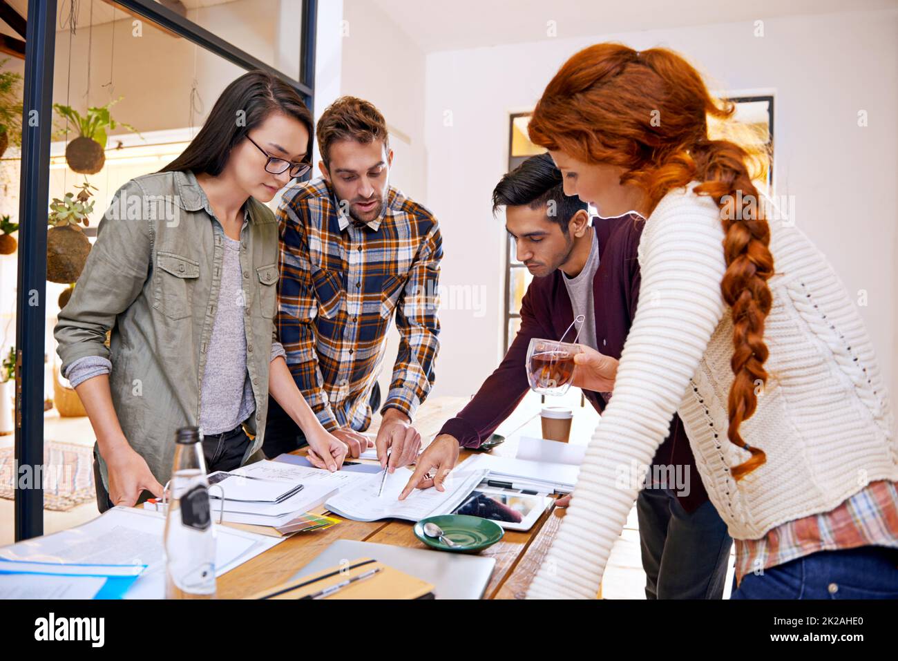Bringing their ideas to the table. a team of young designers working together in their office. Stock Photo