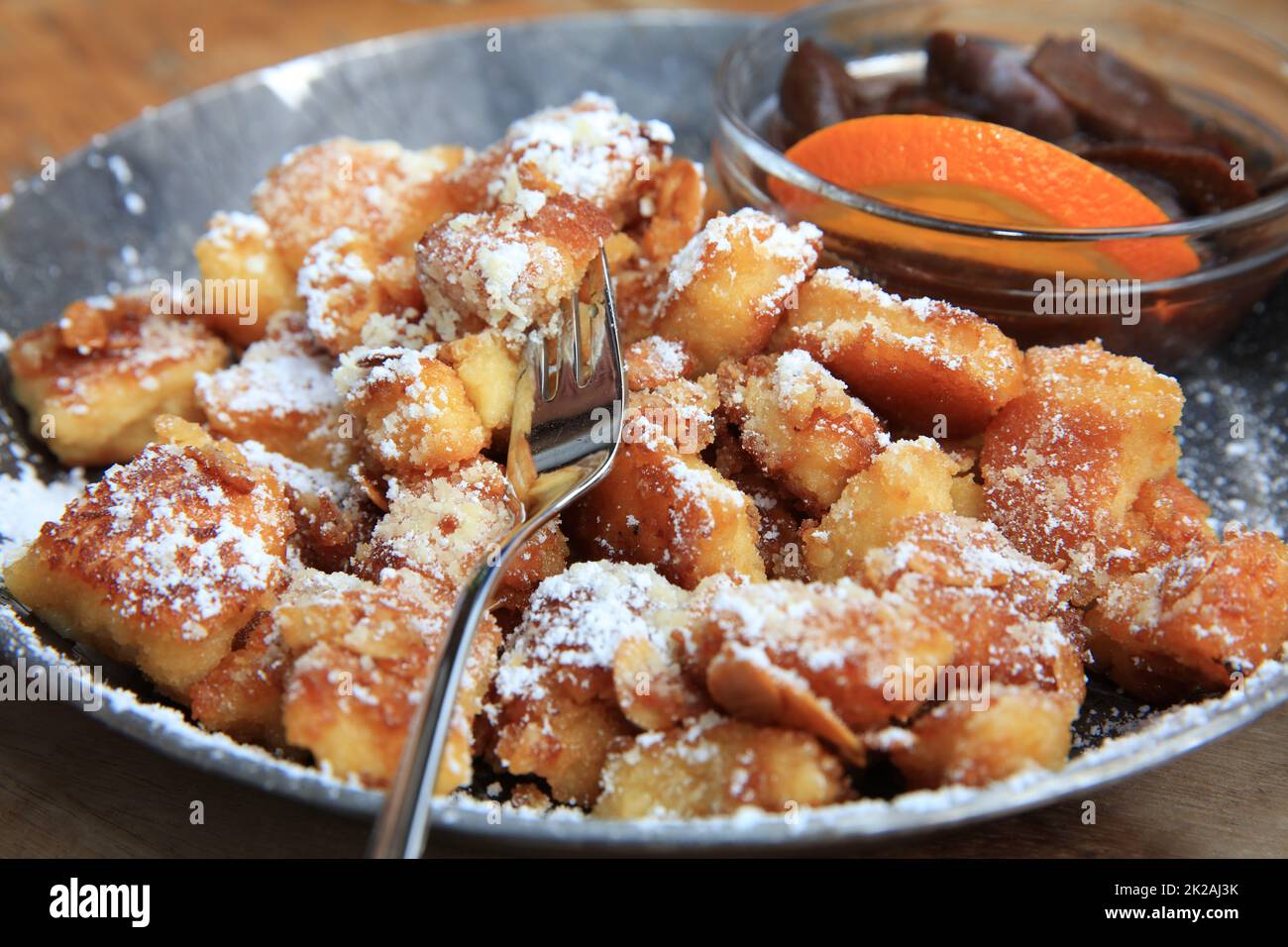 Sugared Pancake with Plums called Kaiserschmarrn. Germany Stock Photo