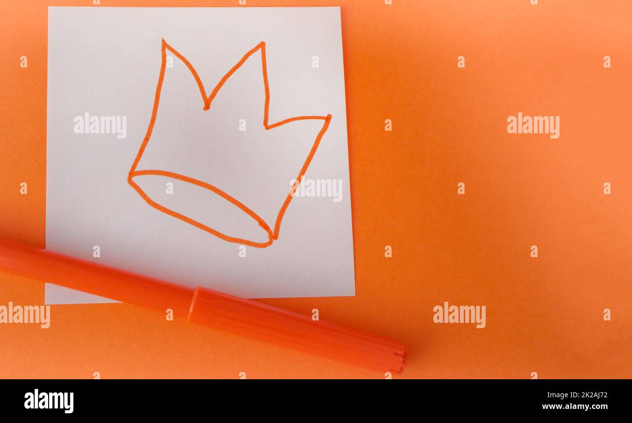 A template in the traditional colors of the King's Day celebration in the Netherlands. A hand-drawn cute crown with an orange felt-tip pen Stock Photo