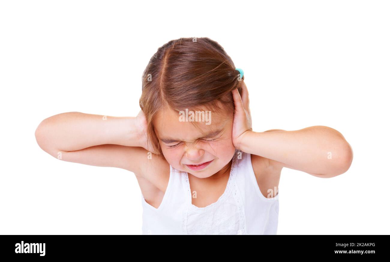 Thats too loud. A little girl covering her ears and closing her eyes. Stock Photo