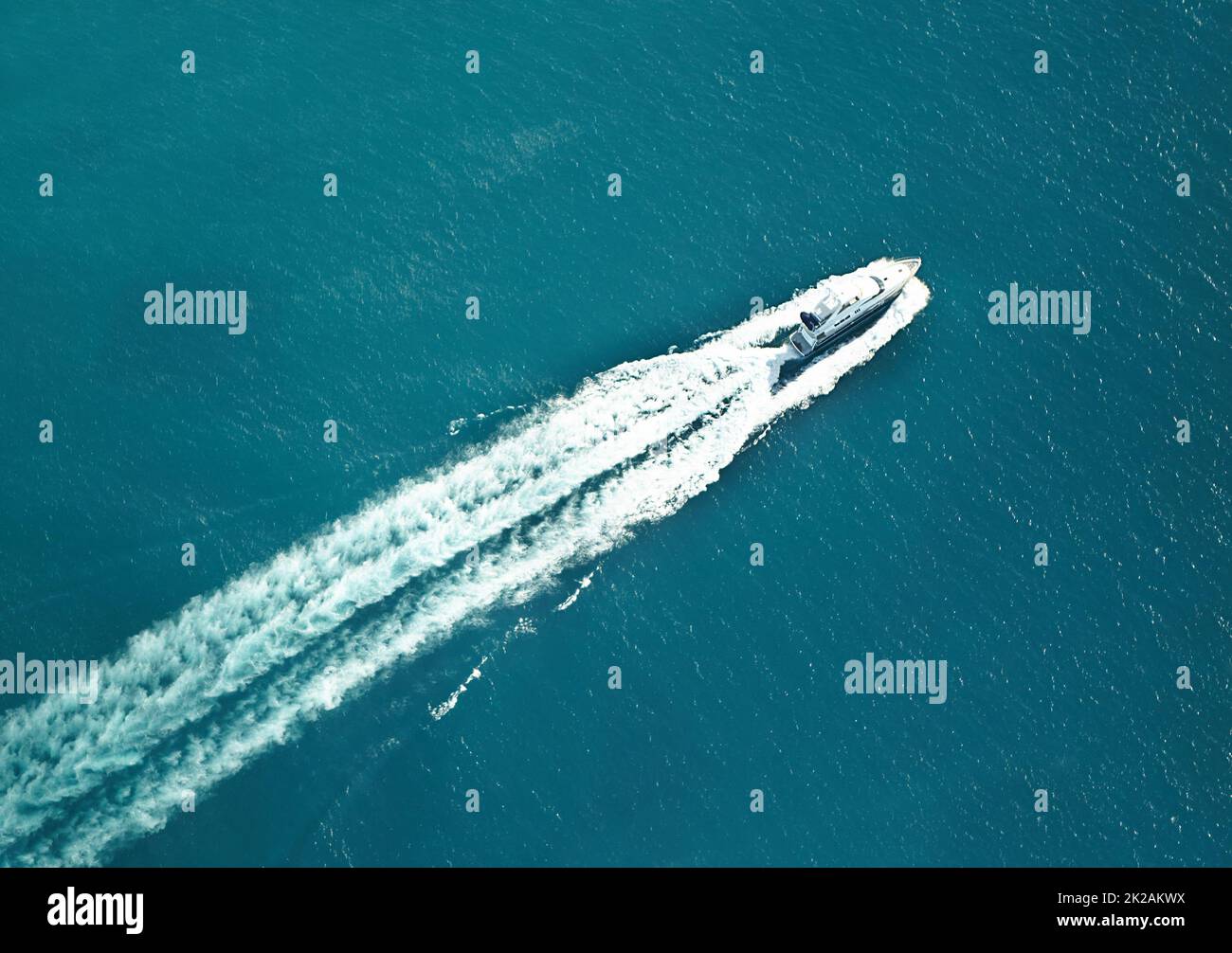 Eat my wake. High angle shot of a boat speeding through the water. Stock Photo