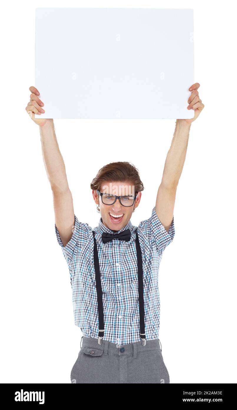 Hes proud to bring you something brand new. Portrait of an excited young man holding up a white sign. Stock Photo