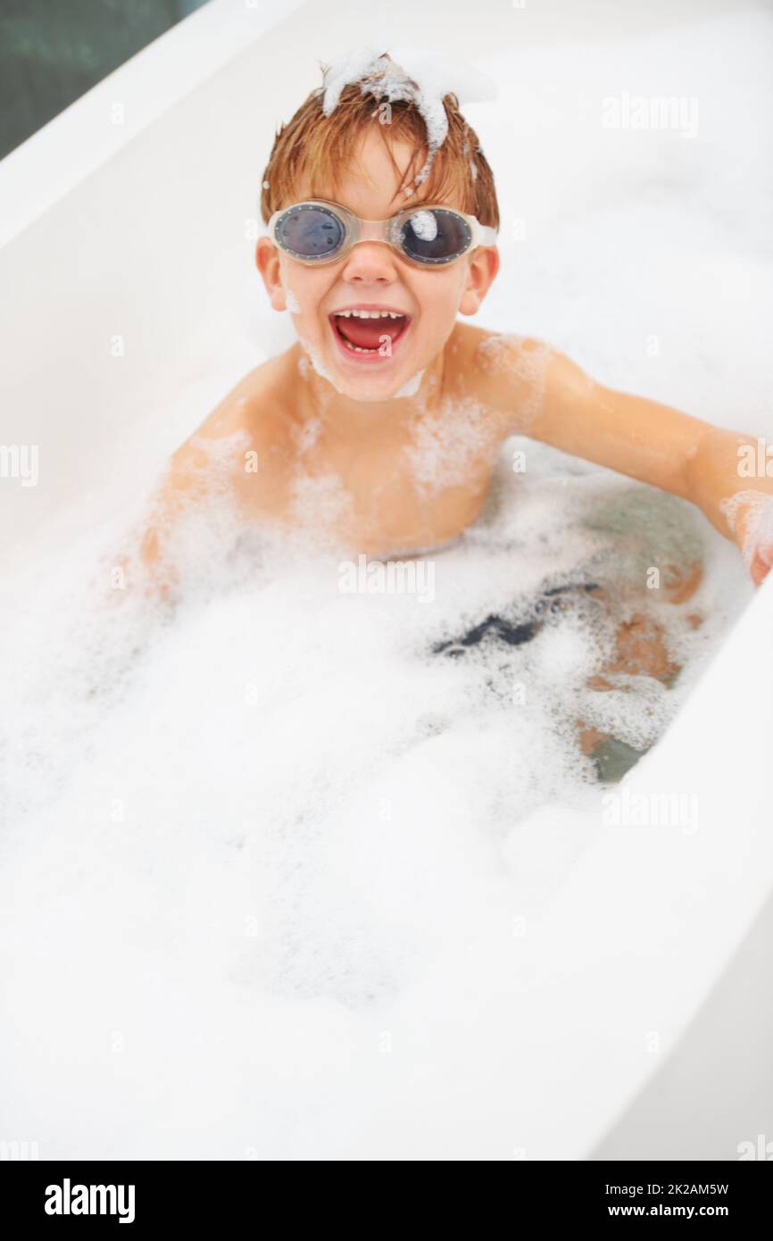 The goggles keep soap out of my eyes. Portrait of a cute young boy