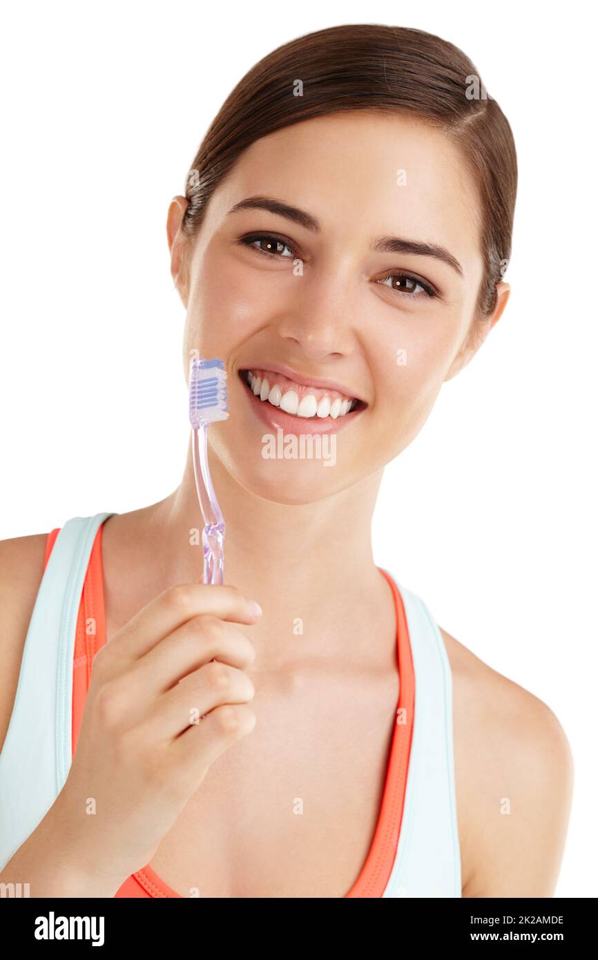Give yourself something to smile about. Beautiful young lady holding toothbrush and smiling. Stock Photo