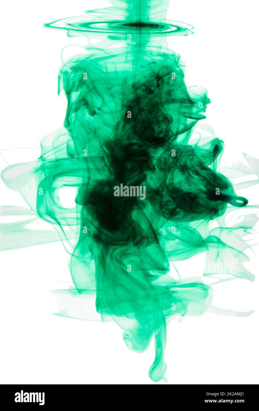 Brilliant green color explosion. Studio shot of green ink in water against a white background. Stock Photo