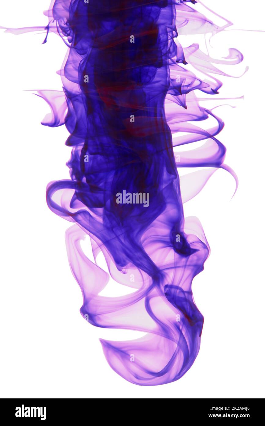Color me purple. Studio shot of purple ink in water against a white background. Stock Photo