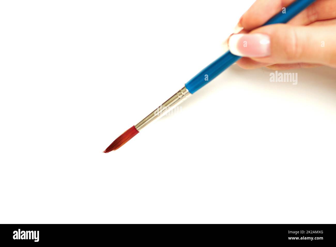 Close Up View Of A Hand Holding A Paintbrush High-Res Stock Photo