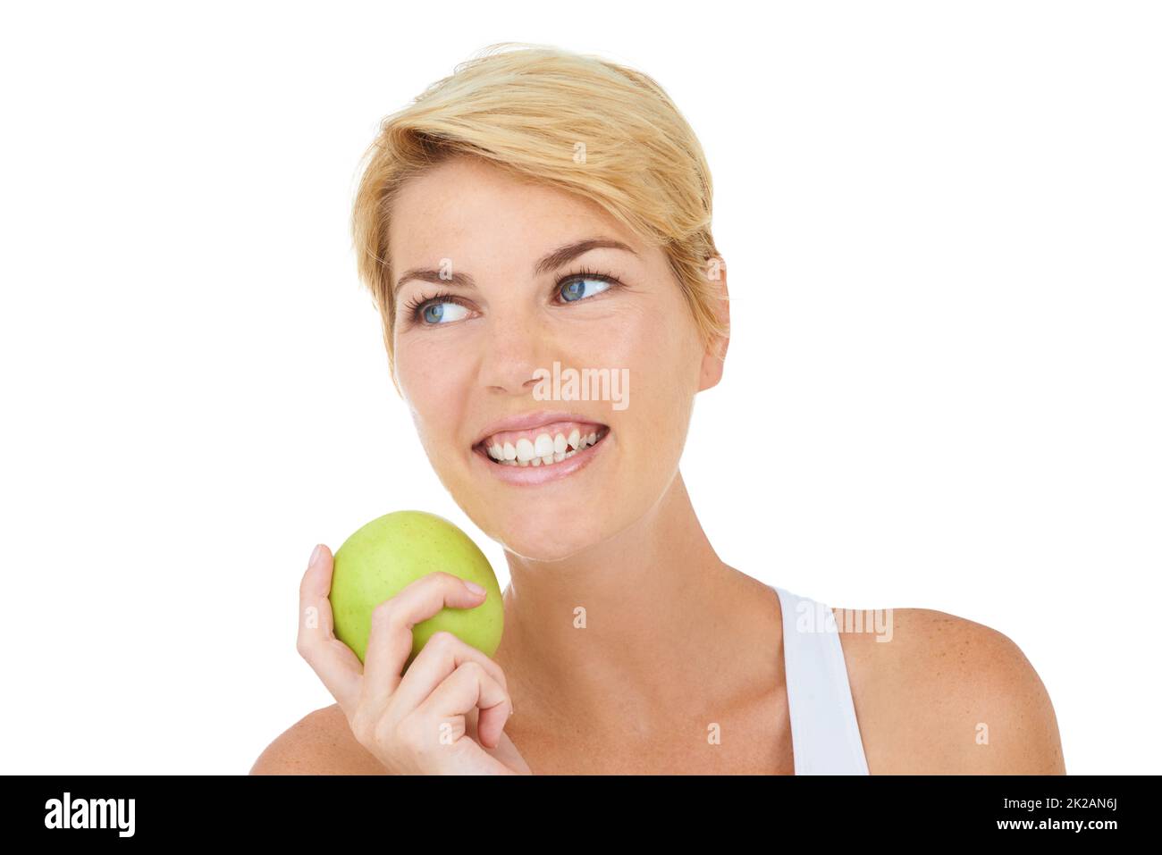 She has to stick to her eating plan. Cropped shot of a young woman holding an apple. Stock Photo