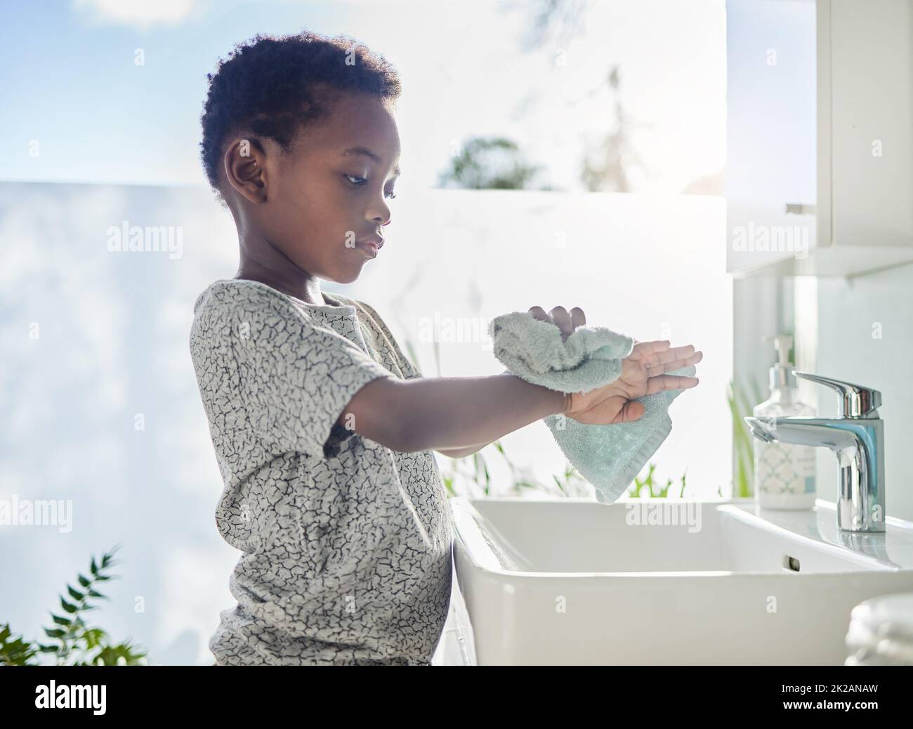 https://c8.alamy.com/comp/2K2ANAW/hes-a-clean-kid-shot-of-a-little-boy-drying-his-hands-with-a-towel-in-a-bathroom-at-home-2K2ANAW.jpg