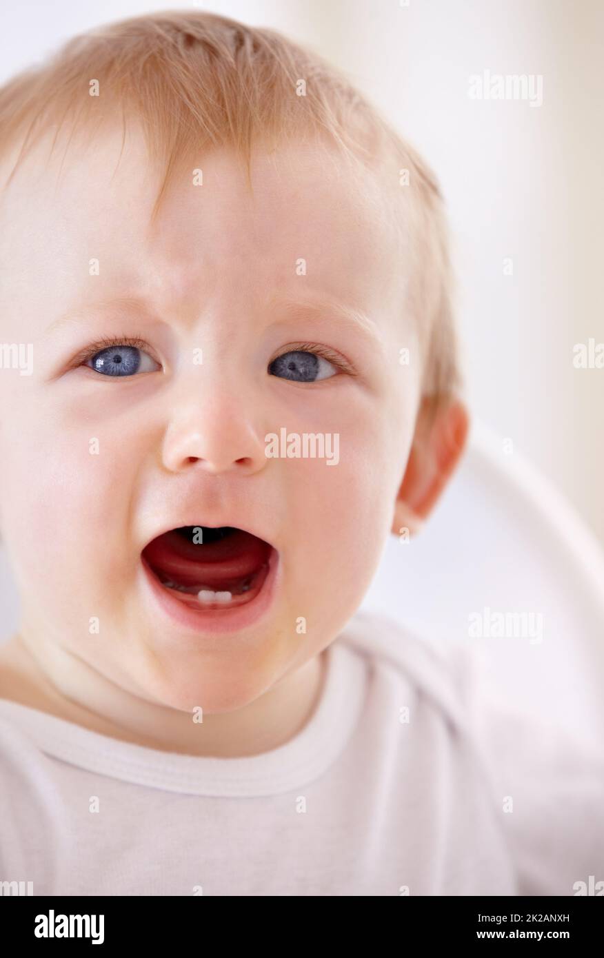 Oh no, wheres she gone now. Closeup shot of a baby boy shouting for a little attention. Stock Photo