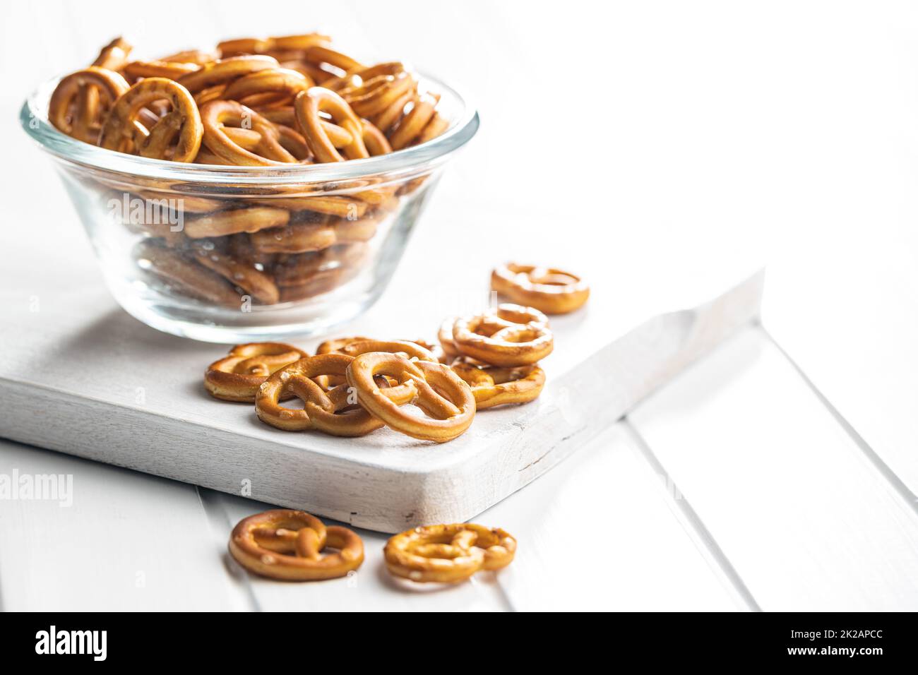Mini pretzels. Crusty salted snack in bowl. Stock Photo