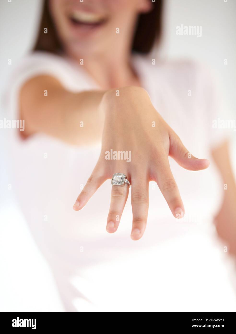 Symbols of life long love. Cropped shot of a womans hand displaying an engagement ring. Stock Photo