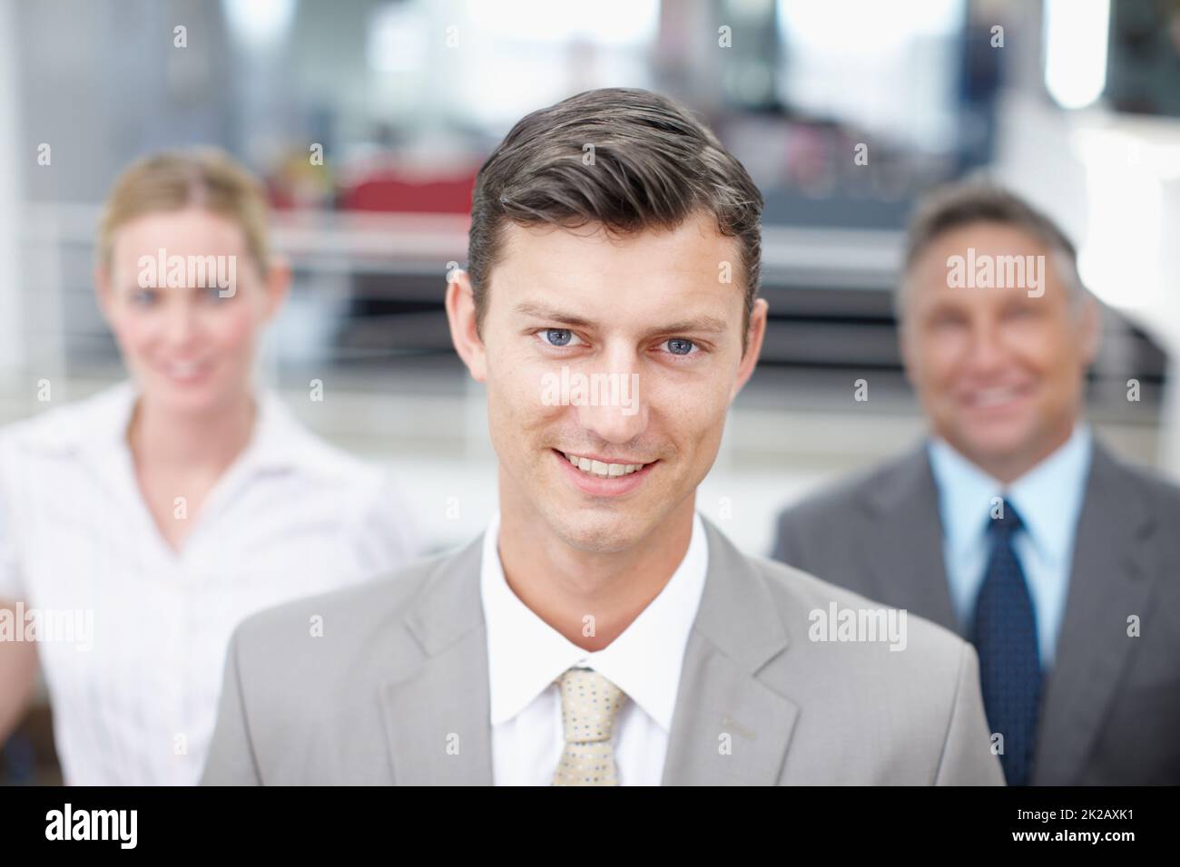 His ideas always have their support. Portrait of an ambitious executive with colleagues standing behind him. Stock Photo