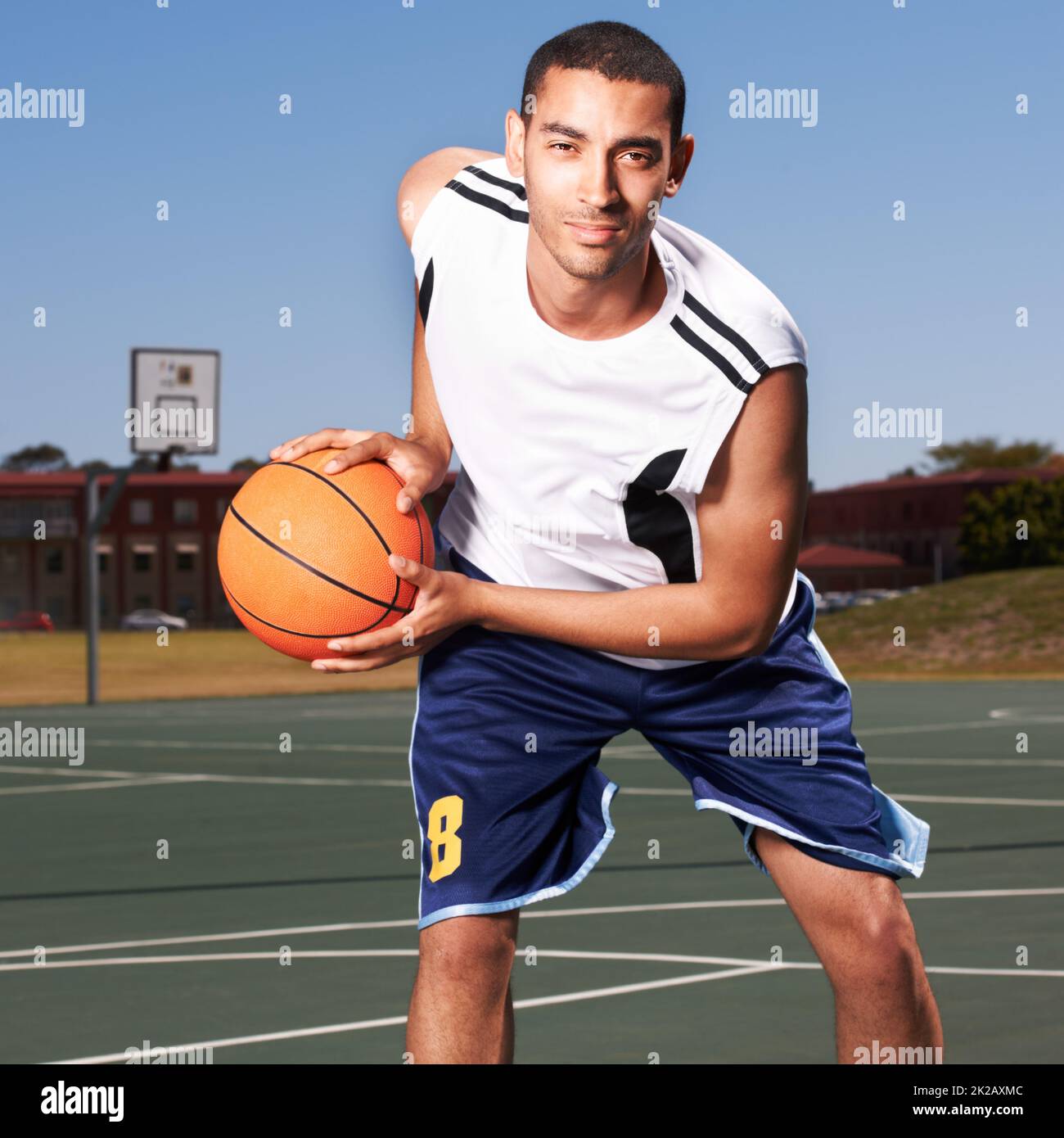Ive got skills. A young basketball player prepares to dribble a ball. Stock Photo