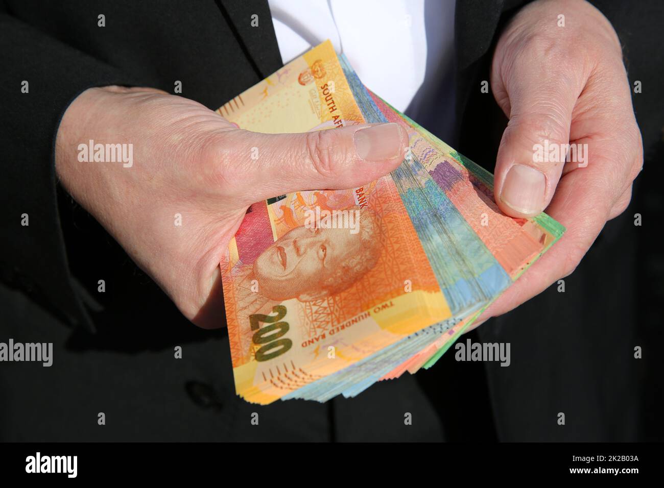Businessman with south african currency stock photo alamy