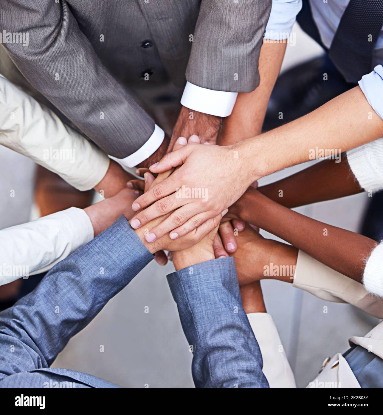 Go, go power business. Cropped shot of a group of businesspeople standing in a huddle with their hands piled up. Stock Photo