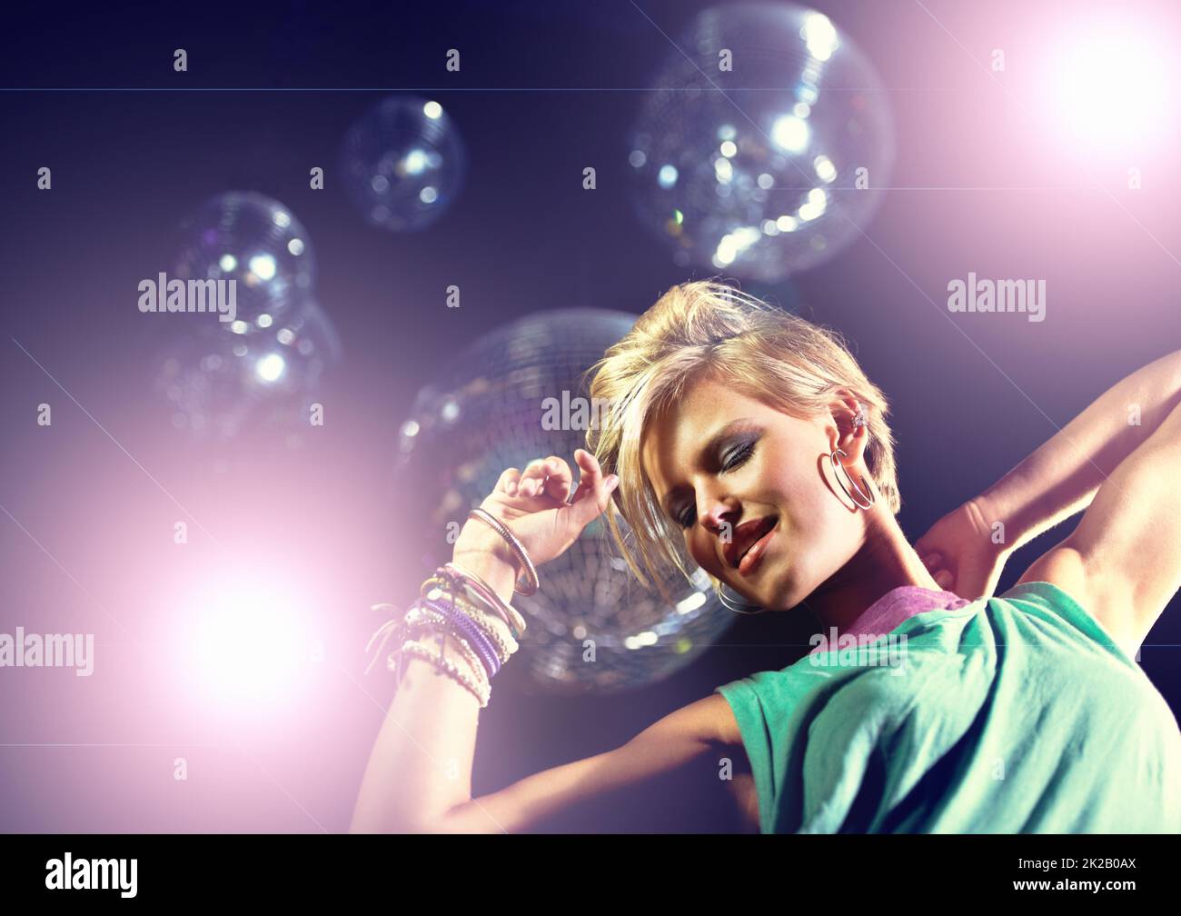 Partying the night away. Shot of an attractive and stylish young woman in a night club. Stock Photo